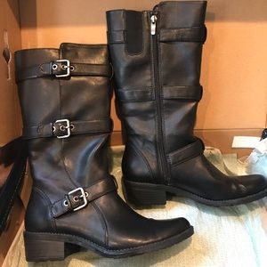 Anne Klein tall black boots with silver buckles.